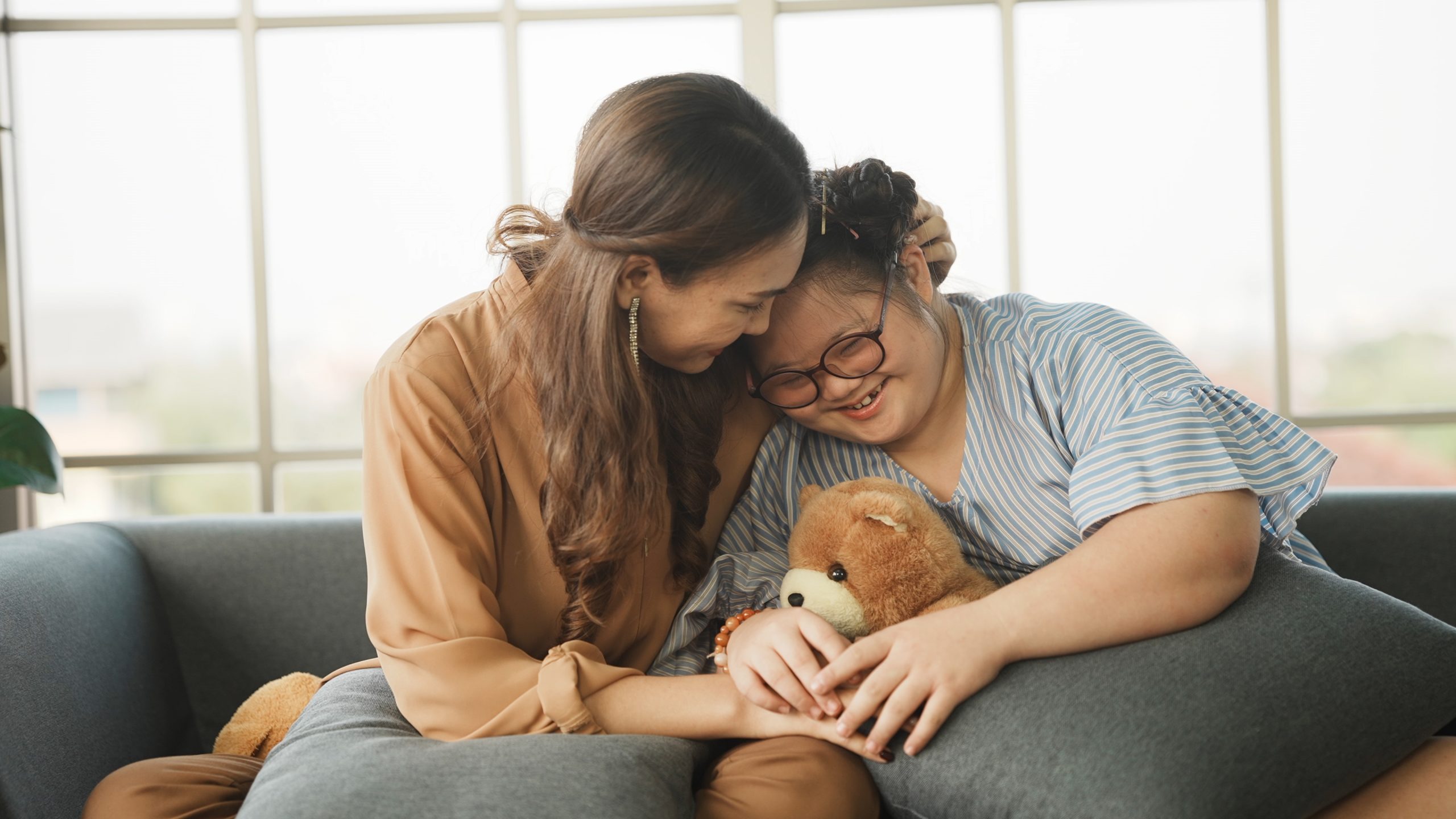 Mother,Supporting,Sweet,Down,Syndrome,Daughter,To,Learn,And,Relax